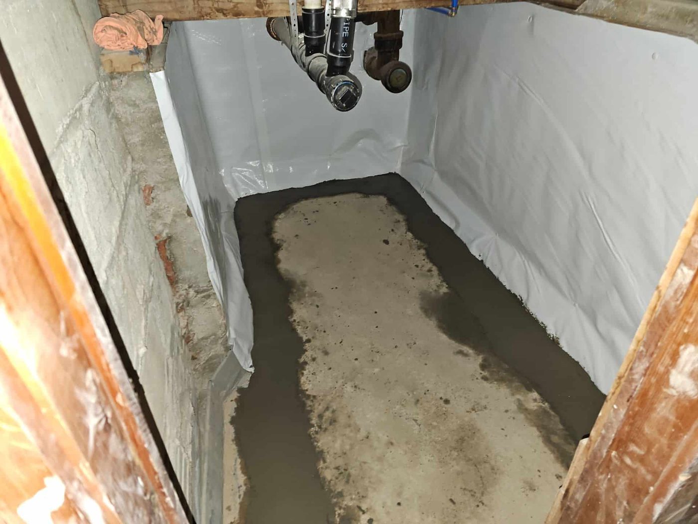 Leak prevention and moisture control in a basement